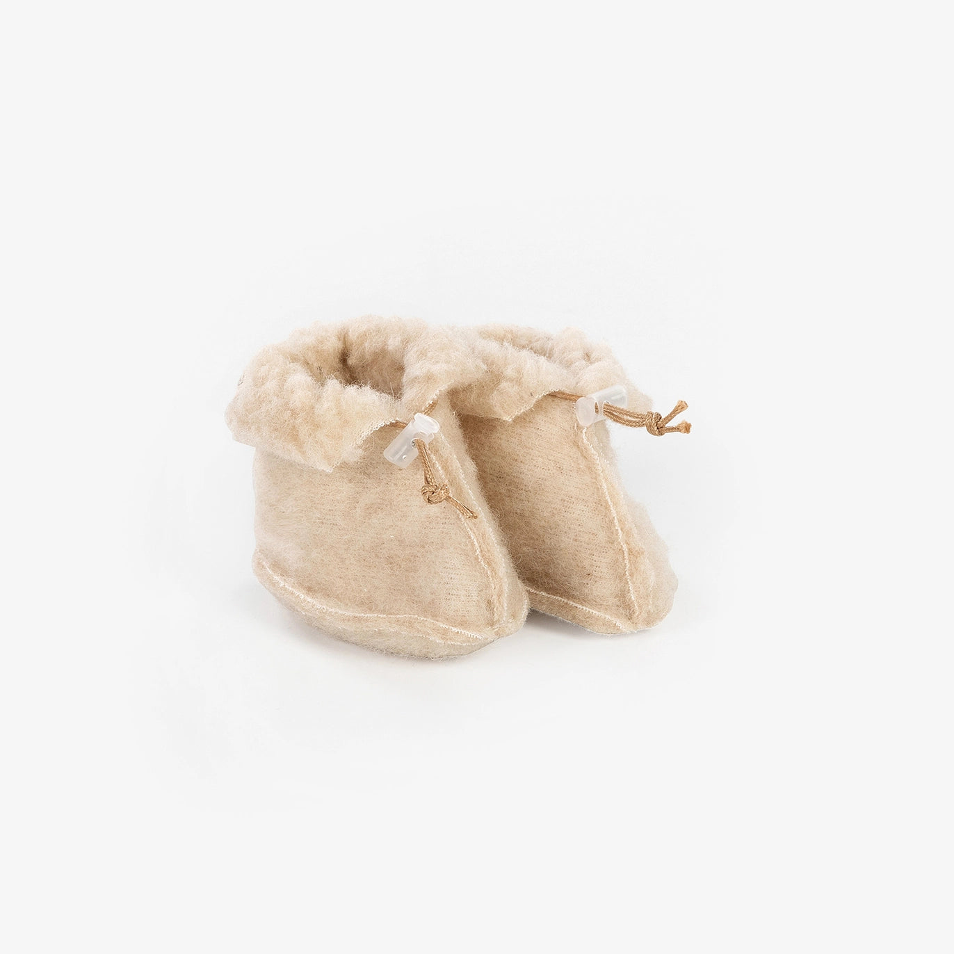 Merino wollen babyslofjes in de kleur beige voor warme en comfortabele babyvoetjes